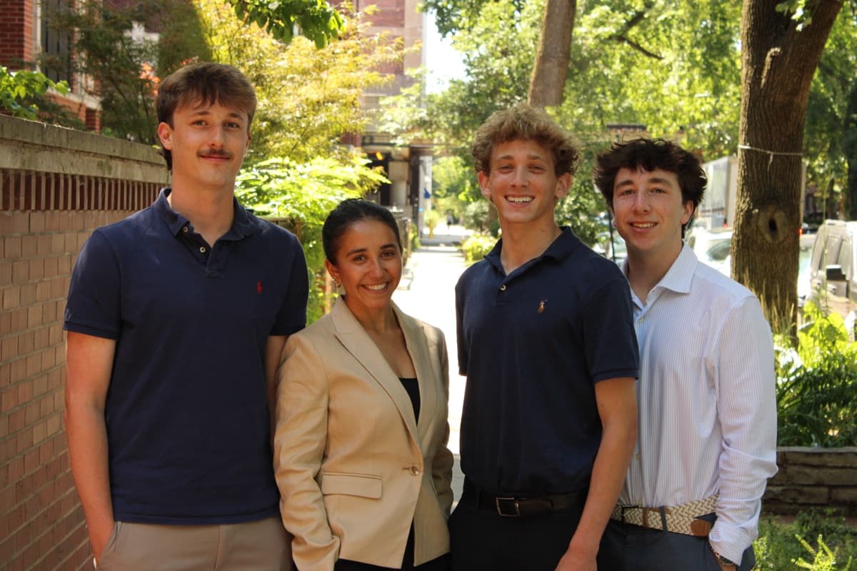 The four College Crew founders standing together on a tree-lined Chicago street